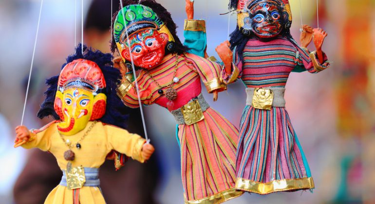 Traditional colorist nepalese paper mache puppets on strings for sale in a souvenir shop in the Thamel area of Kathmandu city. Kathmandu district-Bagmati zone-Nepal